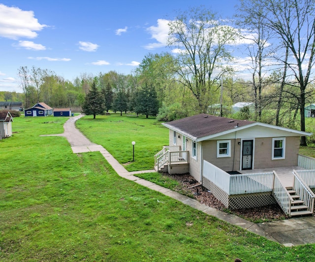 24108 Martinsville Rd, Belleville, MI 48111 - view of green lawn featuring a deck