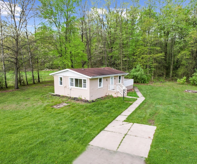 24108 Martinsville Rd, Belleville, MI 48111 - view of front of house featuring a front yard and a wooded view