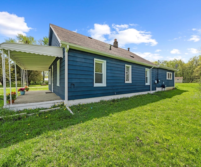 24108 Martinsville Rd, Belleville, MI 48111 - view of side of home featuring a yard and a chimney