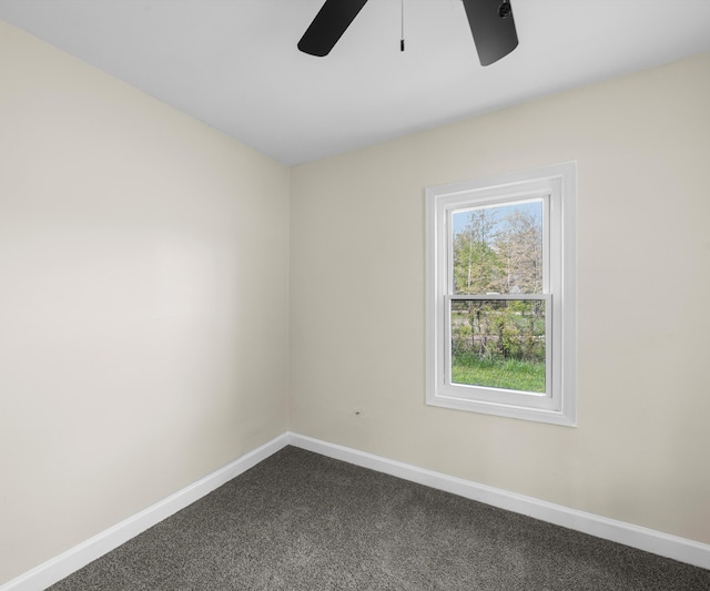 24108 Martinsville Rd, Belleville, MI 48111 - spare room with a ceiling fan, baseboards, and dark colored carpet