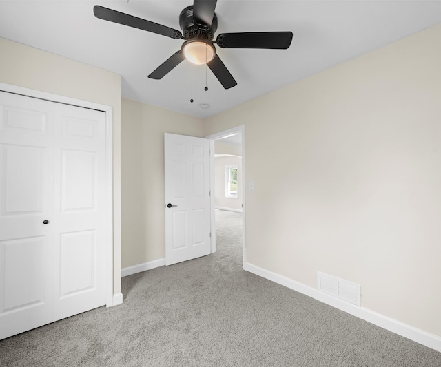 24108 Martinsville Rd, Belleville, MI 48111 - unfurnished bedroom featuring carpet floors, baseboards, a closet, and a ceiling fan