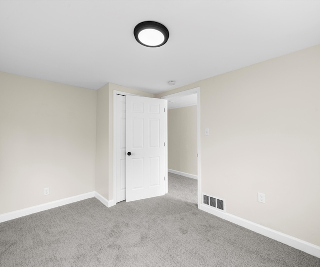 24108 Martinsville Rd, Belleville, MI 48111 - carpeted empty room with baseboards and a smoke detector