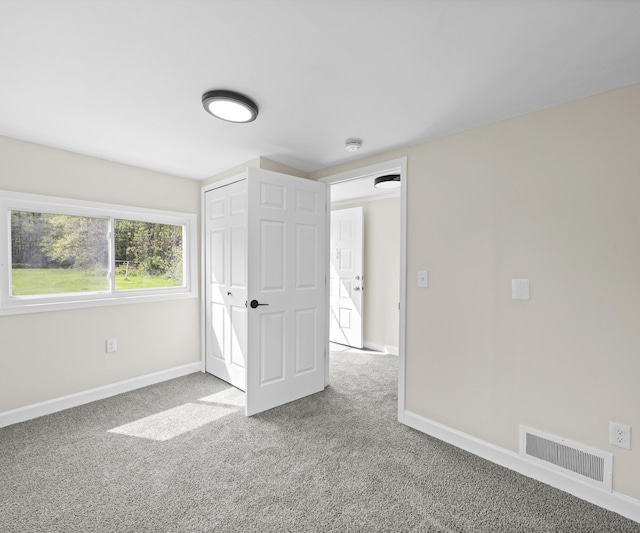 24108 Martinsville Rd, Belleville, MI 48111 - unfurnished bedroom featuring carpet flooring, baseboards, and a closet