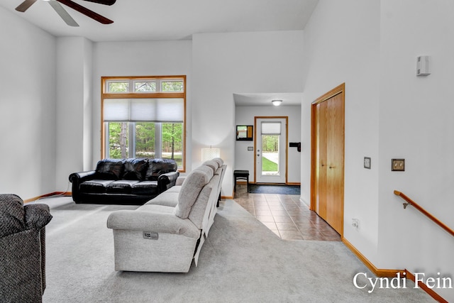 2970 Braden Blvd, Dorr, MI 49323 - living area with a ceiling fan, carpet flooring, baseboards, and tile patterned floors