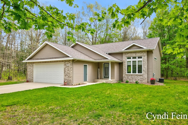 2970 Braden Blvd, Dorr, MI 49323 - view of front of house with a garage, a shingled roof, driveway, and a front lawn