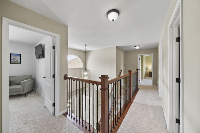 510 Edward J St, Clinton, MI 49236 - hallway with carpet flooring, an upstairs landing, and baseboards
