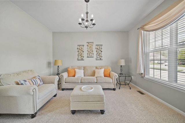 510 Edward J St, Clinton, MI 49236 - living room featuring a chandelier, baseboards, and carpet