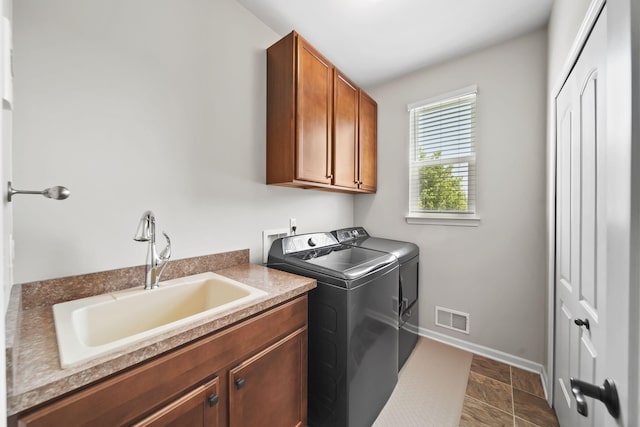 510 Edward J St, Clinton, MI 49236 - laundry area with washer and clothes dryer, cabinet space, and baseboards