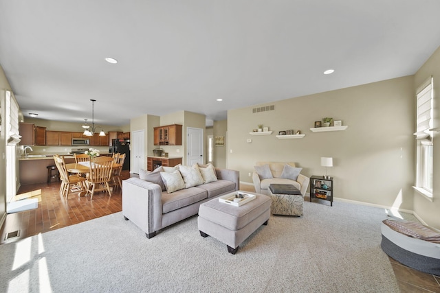 510 Edward J St, Clinton, MI 49236 - living room featuring carpet flooring, a chandelier, recessed lighting, and baseboards