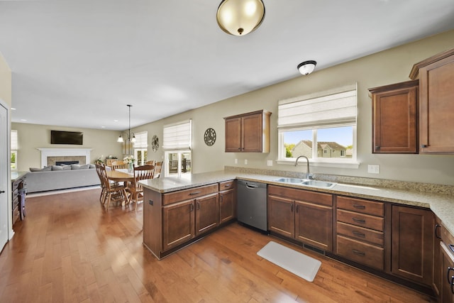 510 Edward J St, Clinton, MI 49236 - kitchen featuring dishwasher, a sink, a peninsula, dark wood finished floors, and recessed lighting