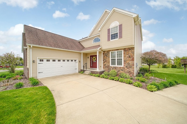 510 Edward J St, Clinton, MI 49236 - traditional home featuring stone siding, concrete driveway, a front yard, an attached garage, and a shingled roof