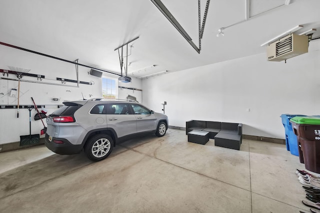 510 Edward J St, Clinton, MI 49236 - garage featuring a garage door opener