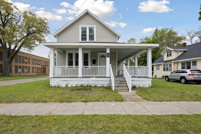 602 Ada Ave, Muskegon, MI 49442 - view of front of home featuring covered porch and a front lawn