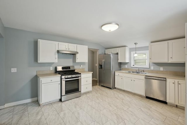 602 Ada Ave, Muskegon, MI 49442 - kitchen featuring appliances with stainless steel finishes, under cabinet range hood, a sink, light countertops, and white cabinets