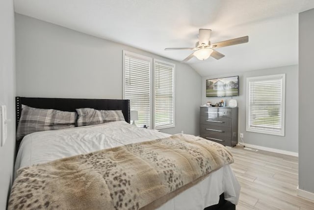 602 Ada Ave, Muskegon, MI 49442 - bedroom with baseboards, light wood finished floors, ceiling fan, and vaulted ceiling