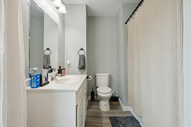 602 Ada Ave, Muskegon, MI 49442 - bathroom featuring wood finished floors, vanity, toilet, and a shower with shower curtain
