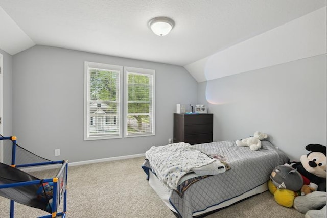 602 Ada Ave, Muskegon, MI 49442 - bedroom featuring lofted ceiling, carpet flooring, and baseboards