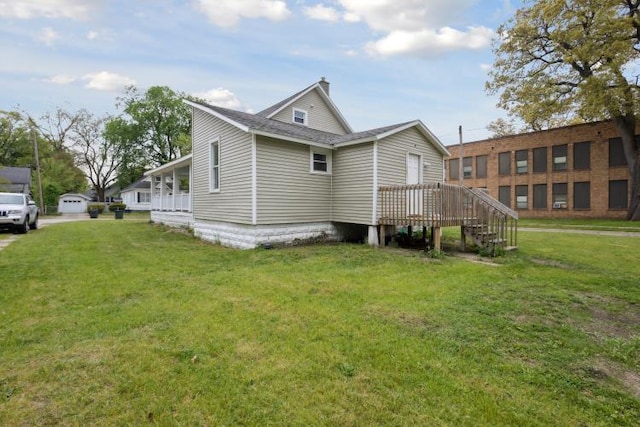 602 Ada Ave, Muskegon, MI 49442 - view of side of property featuring a yard and a chimney