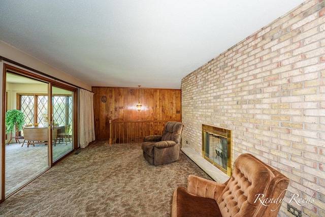 12498 Daling Ct NW, Grand Rapids, MI 49534 - sitting room with wood walls, carpet flooring, and a fireplace