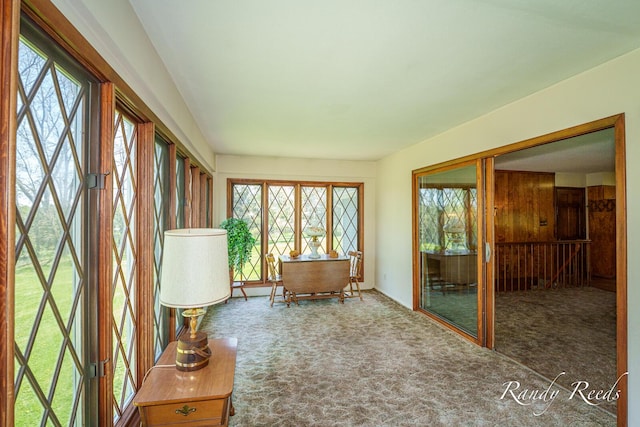 12498 Daling Ct NW, Grand Rapids, MI 49534 - unfurnished sunroom with plenty of natural light and carpet flooring