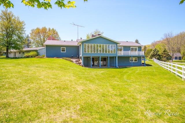 12498 Daling Ct NW, Grand Rapids, MI 49534 - rear view of property with a sunroom and a wooden deck