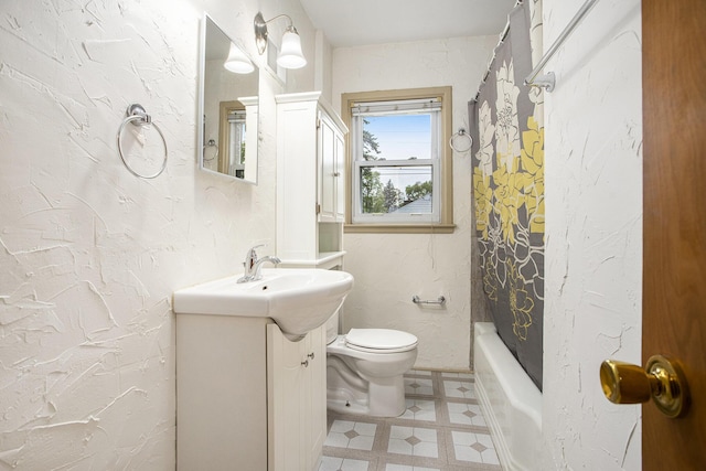 bathroom featuring vanity, toilet, shower / tub combo, and tile patterned floors