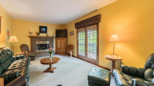 living room featuring carpet flooring, a fireplace, and baseboards