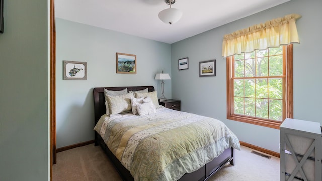 bedroom with carpet flooring and baseboards