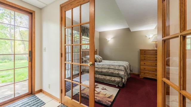 bedroom featuring french doors, baseboards, and access to outside