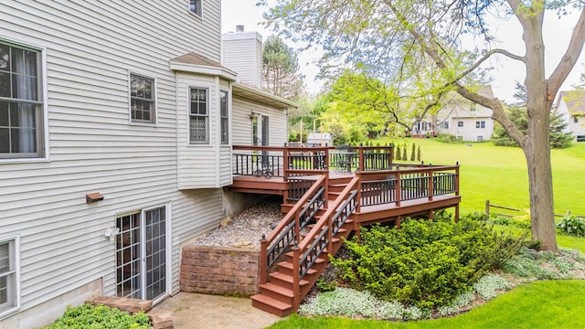 deck with a lawn and stairway
