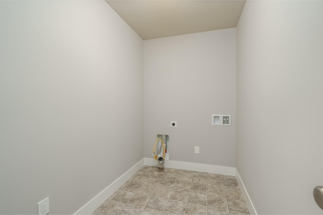 washroom featuring electric dryer hookup, hookup for a washing machine, and baseboards