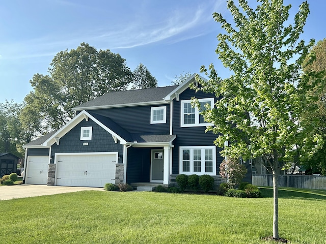view of front facade with a garage, driveway, and stone siding