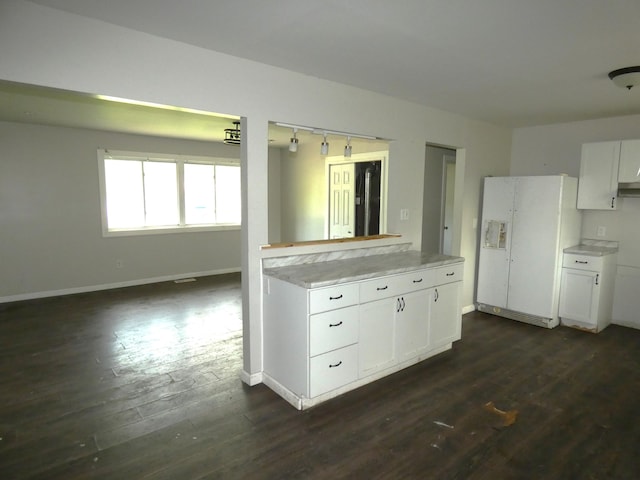 1158 Mcintosh Dr, Benton Harbor, MI 49022 - kitchen featuring white fridge with ice dispenser, dark wood-type flooring, light countertops, white cabinets, and baseboards
