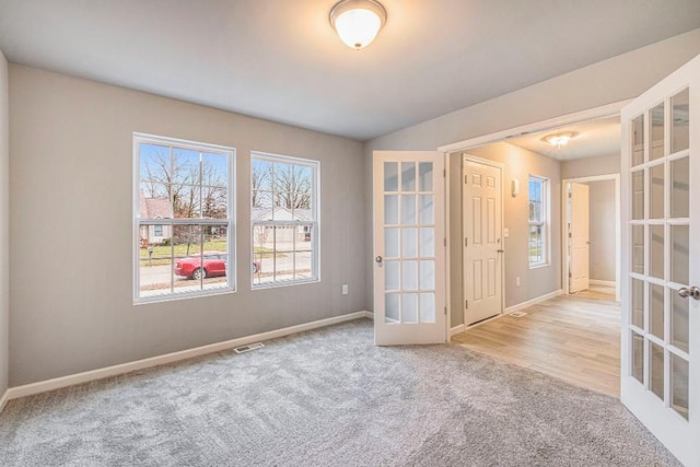 13686 Oasis Ave, Holland, MI 49424 - carpeted spare room with french doors and baseboards
