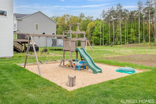 12745 Riverton Rd, Grand Haven, MI 49417 - view of play area with a yard, a trampoline, and stairway