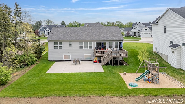 12745 Riverton Rd, Grand Haven, MI 49417 - rear view of property with a patio area, a playground, a yard, a residential view, and roof with shingles