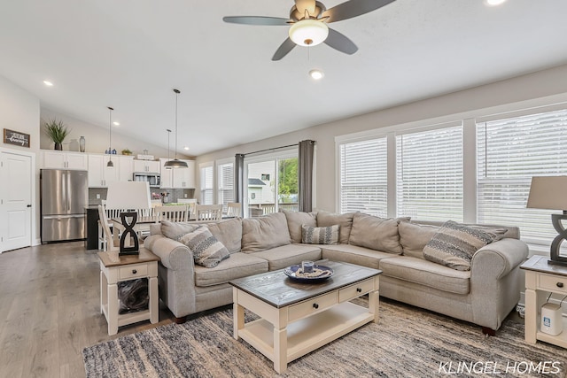 12745 Riverton Rd, Grand Haven, MI 49417 - living area with vaulted ceiling, ceiling fan, wood finished floors, and recessed lighting