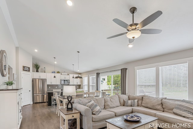 12745 Riverton Rd, Grand Haven, MI 49417 - living room featuring lofted ceiling, light wood finished floors, ceiling fan, and recessed lighting