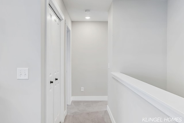 12745 Riverton Rd, Grand Haven, MI 49417 - corridor with light carpet and baseboards