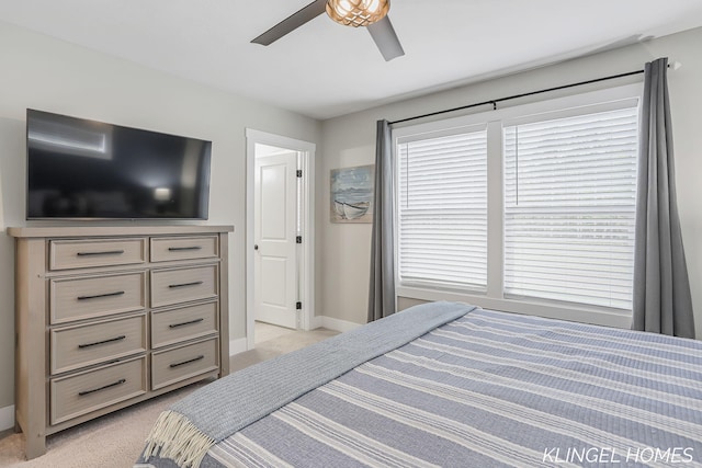 12745 Riverton Rd, Grand Haven, MI 49417 - bedroom with light colored carpet, baseboards, and ceiling fan