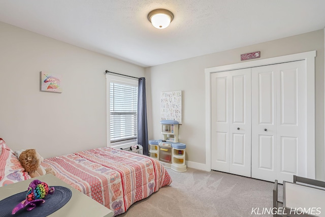 12745 Riverton Rd, Grand Haven, MI 49417 - bedroom featuring carpet floors, a closet, and baseboards