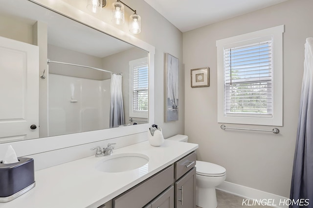 12745 Riverton Rd, Grand Haven, MI 49417 - bathroom with toilet, vanity, baseboards, and a shower with curtain