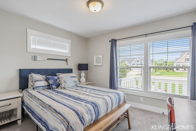12745 Riverton Rd, Grand Haven, MI 49417 - carpeted bedroom featuring baseboards