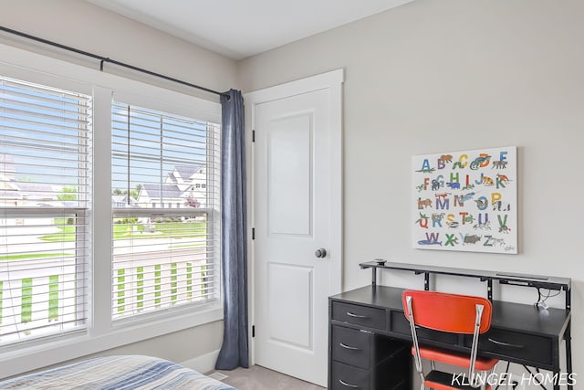 12745 Riverton Rd, Grand Haven, MI 49417 - bedroom featuring an office area and light carpet