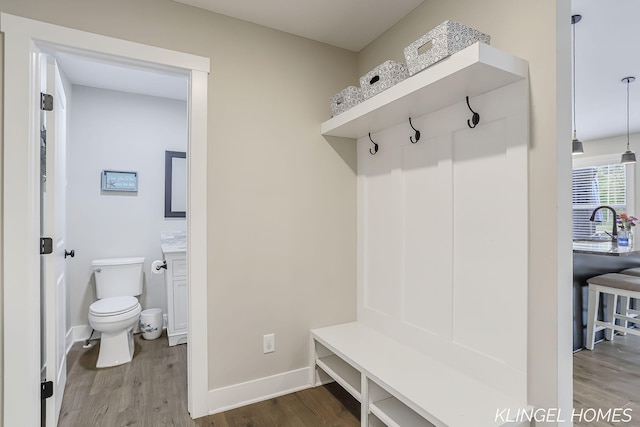 12745 Riverton Rd, Grand Haven, MI 49417 - mudroom with wood finished floors and baseboards