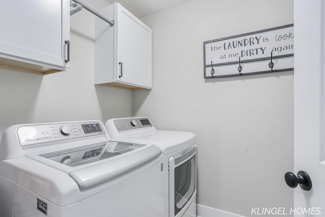 12745 Riverton Rd, Grand Haven, MI 49417 - laundry area featuring washing machine and clothes dryer and cabinet space