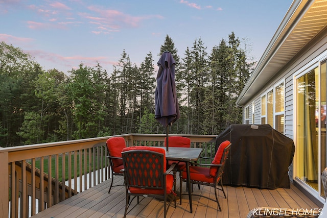 12745 Riverton Rd, Grand Haven, MI 49417 - deck featuring outdoor dining space and area for grilling
