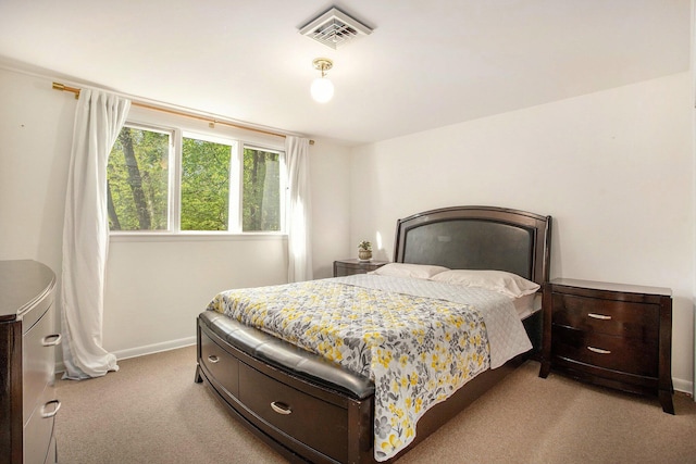 carpeted bedroom featuring baseboards