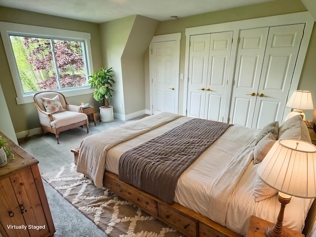 928 Lincoln St, Grand Rapids, MI 49534 - carpeted bedroom featuring baseboards and multiple closets