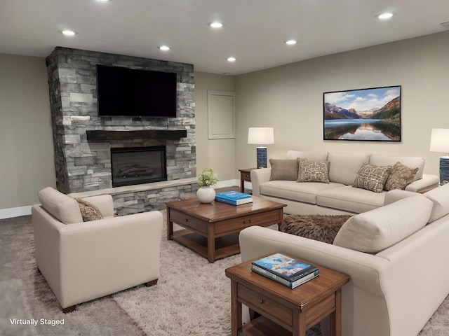 928 Lincoln St, Grand Rapids, MI 49534 - carpeted living area with recessed lighting, a stone fireplace, and baseboards